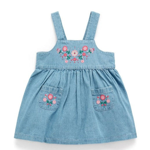 Blue denim dress with floral embroidery on a white background