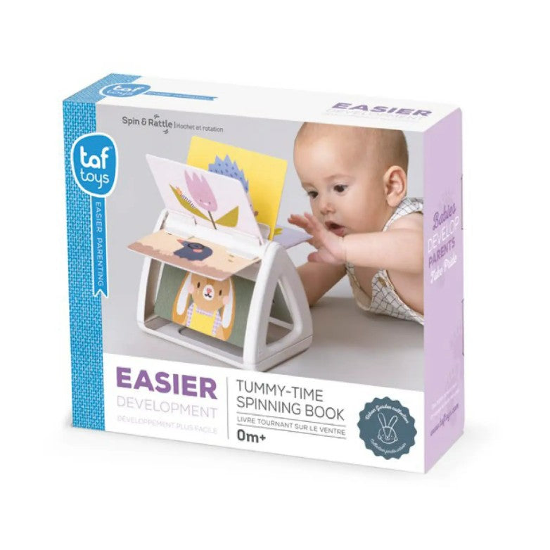 Taf Toys Easier Tummy-Time Spinning Book packaging with a baby playing on a white surface.